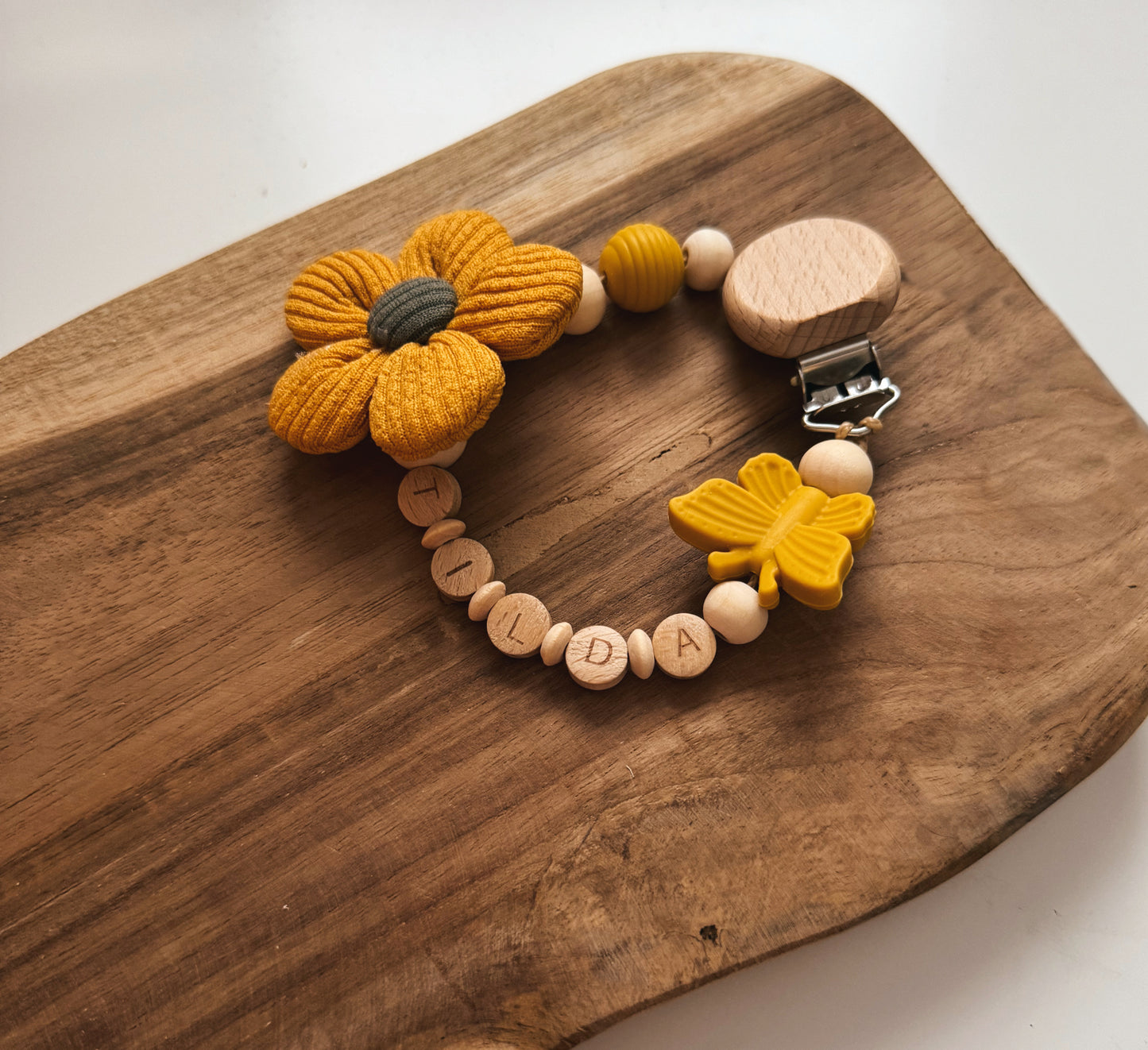 Schnullerkette aus Holz mit Stoffblume | Blume | rosa, gelb oder blaugrau