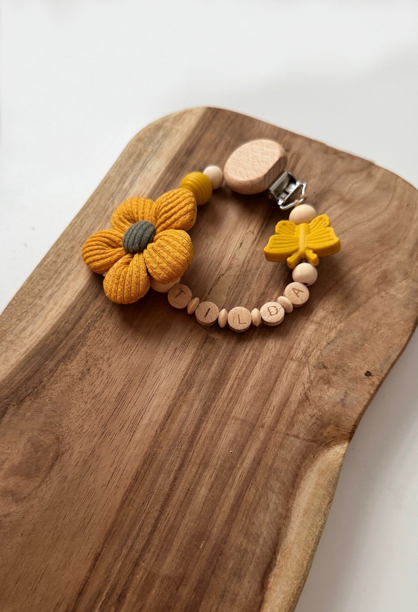Schnullerkette aus Holz mit Stoffblume | Blume | rosa, gelb oder blaugrau