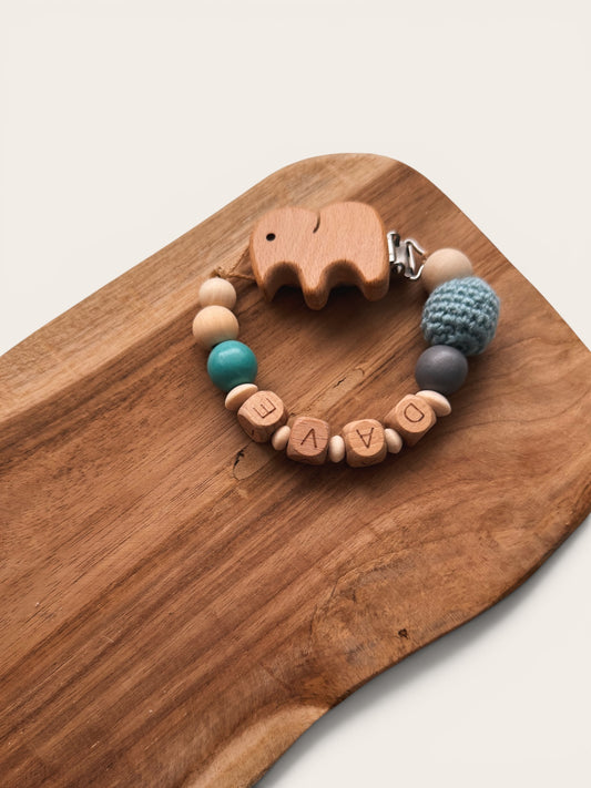 Elefantenliebe - Kinderwagenkette, Greifring, Rassel & Schnullerkette - mit Namen personalisierbar | aus Holzperlen | blau grau